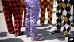 Who wears the pants in your family? These people wearing colorful pants may think they do. But maybe not. (AP PHOTO)
