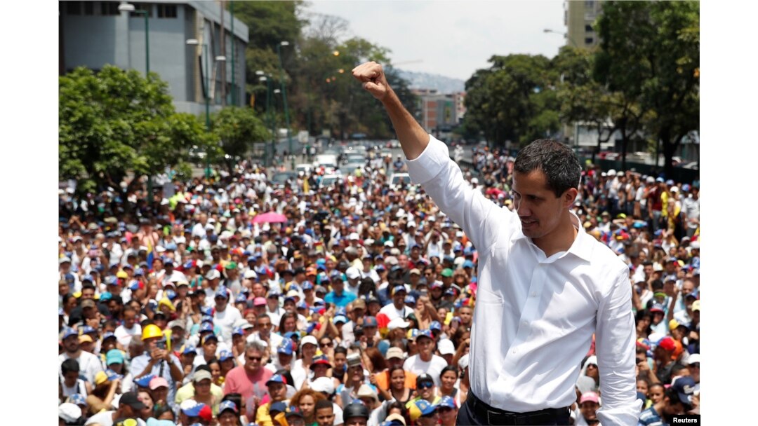 FILE - Venezuelan opposition leader Juan Guaido gestures as he speaks to supporters during a rally against the government of President Nicolas Maduro.
