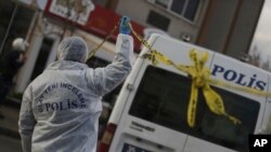 FILE - Police forensic officers work at the scene of an explosion, in Izmir, Turkey, Jan. 5, 2017. Kurdish militants have claimed responsibility for last week's car bombing attack in Izmir. 