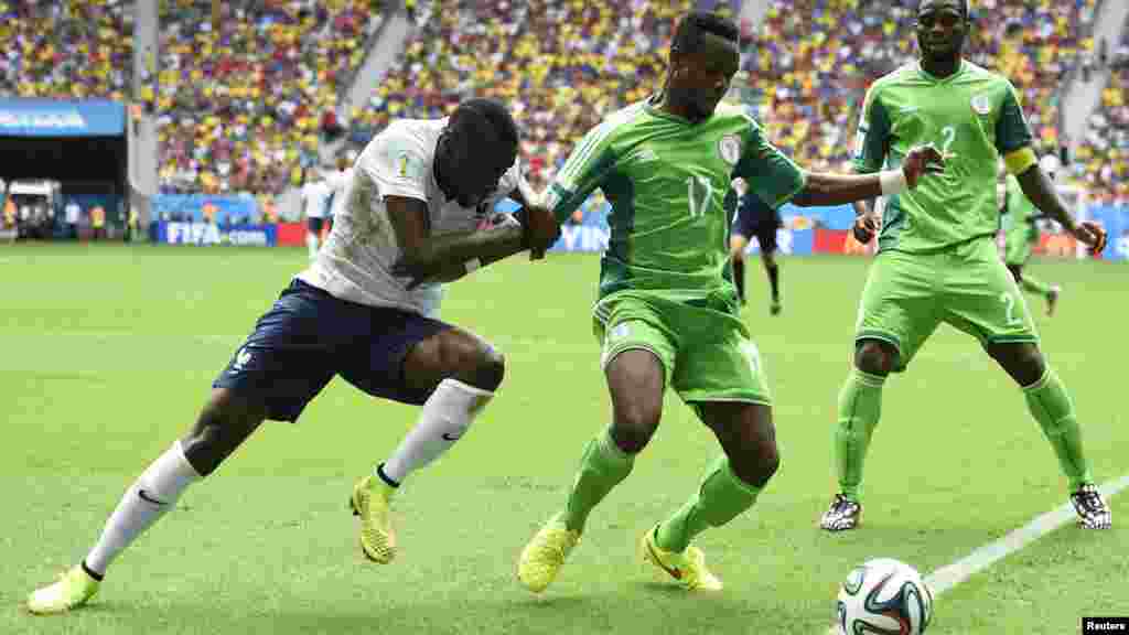 France's Blaise Matuidi fights for the ball with Nigeria's Ogenyi Onazi and Joseph Yobo.