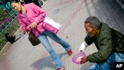 Some say China's new charity law is mean to make donating easier for China's middle and upper classes.