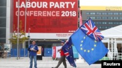 Pro-EU supporters demonstrate on the streets outside the conference venue before the start of the Labour Party Conference in Liverpool, Sept. 22, 2018. 