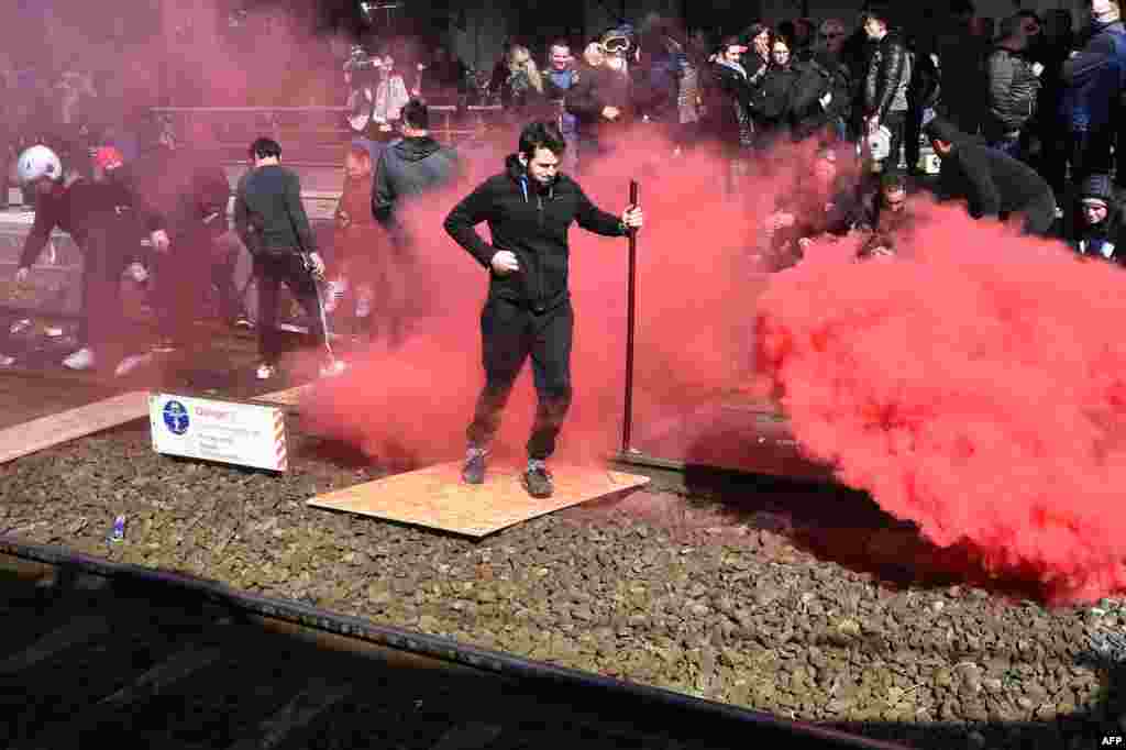 Fairground workers block the rail track of Le Mans railway station to demand a return of the fairground to the center of the city, in Le Mans, France.
