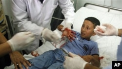 A Palestinian schoolboy injured in the blast receives treatment at a hospital in the southern Gaza strip town of Rafah, 20 Oct 2010