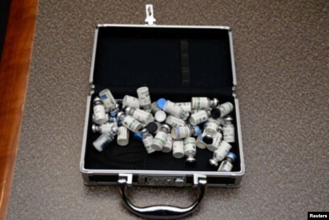 A locked case containing bottles of Tramodol uncovered by U.S. federal investigators in the home of U.S. Coast Guard Lt. Christopher Paul Hasson in Silver Spring, Md., in a photo provided Feb. 20, 2019.