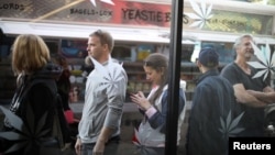 Customers queue for recreational marijuana outside the MedMen store in West Hollywood, California, Jan. 2, 2018. 