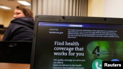 Liz Carlson, a self-employed student, attends a health care enrolment fair.