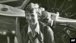 Amelia Earhart with her Lockheed Vega airplane