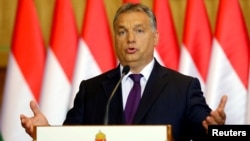 FILE - Hungarian Prime Minister Viktor Orban attends a news conference in Budapest, Hungary, Oct. 4, 2016. Orban has ordered the reinforcement of fences on Hungary's southern borders to keep out migrants. 