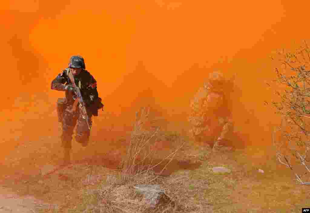 Special Forces soldiers of the Shanghai Cooperation Organization (SCO) member states take part in joint military exercises in the Shamshi gorge, some 100 km of Bishkek, Kyrgyzstan.