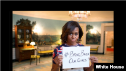The White House posts a Twitter photo showing First Lady Michelle Obama holding a sign with hashtag #BringBackOurGirls, May 7, 2014.