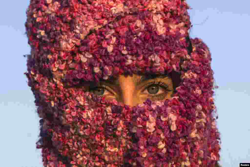 A woman from Syria waits to cross the border with Croatia near the village of Berkasovo, Serbia.