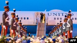 U.S. Vice President Kamala Harris waves upon arrival at the Aeropuerto Internacional La Aurora in Guatemala City on June 6, 2021.