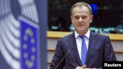 European Council President Donald Tusk speaks before the European Parliament in Brussels Feb. 24, 2016. 