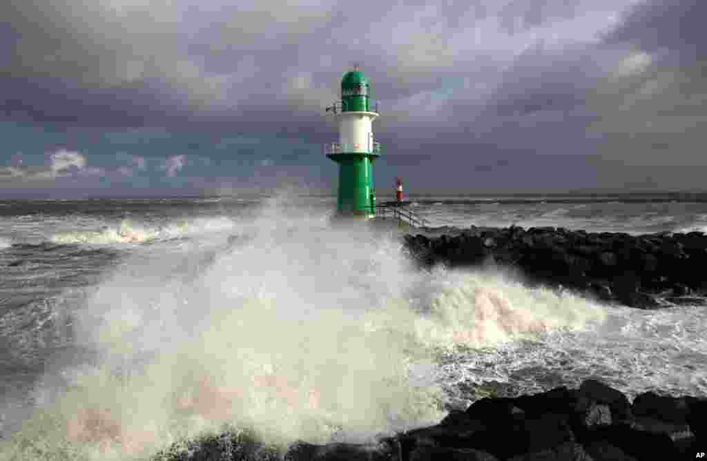 The lighthouse in the harbor of Rostock-Warnemuende. at the Baltic Srea, eastern Germany is flooded. A storm with hurricane-force gusts hit Germany's costal areas as well as Britain, Belgium, The Netherlands, Scandinavia and Poland.