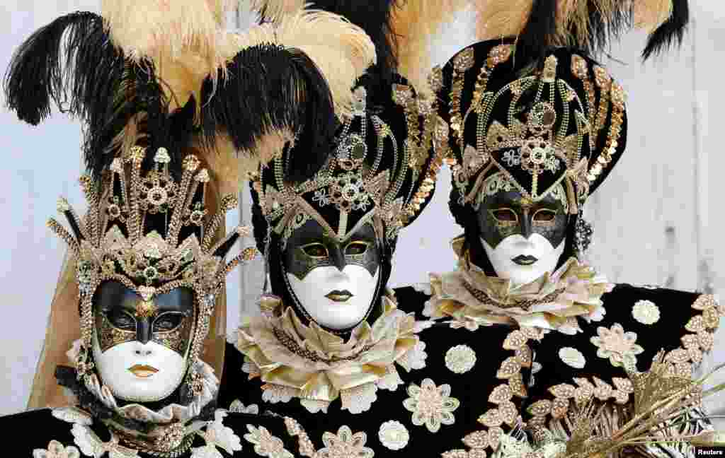 Masked revelers participate in the Carnival in Venice, Italy, March 2, 2019.