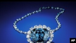 In this photo from the Smithsonian Institution,The Hope Diamond is seen in Washington. The famed diamond glows a mysterious red when exposed to ultraviolet light, a finding that scientists say can help them "fingerprint" diamonds and tell the real ones fr