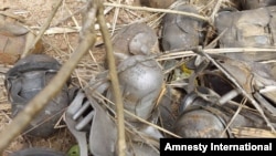 Bomblets from a cluster bomb inside a house in Andona village, Dalami County in Sudan's South Kordofan State