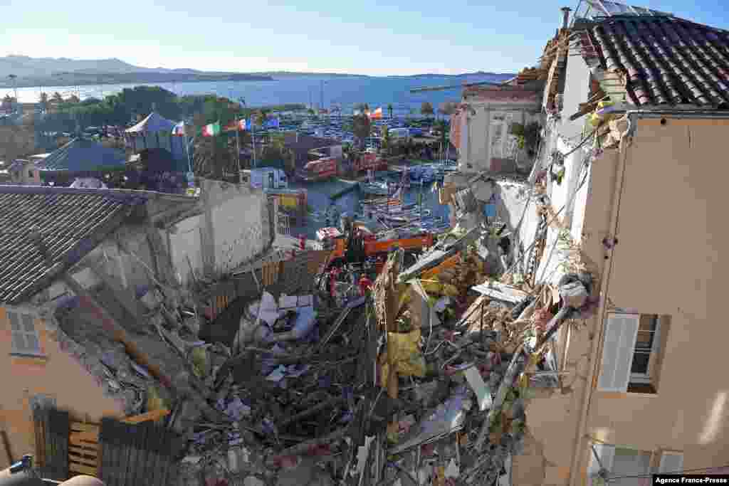 French firefighters search for survivors after a building collapsed in Sanary-sur-Mer, France.&nbsp;Five people likely are trapped in the remains of an apartment building that collapsed overnight following an explosion that may have been caused by a gas leak, firefighters say.