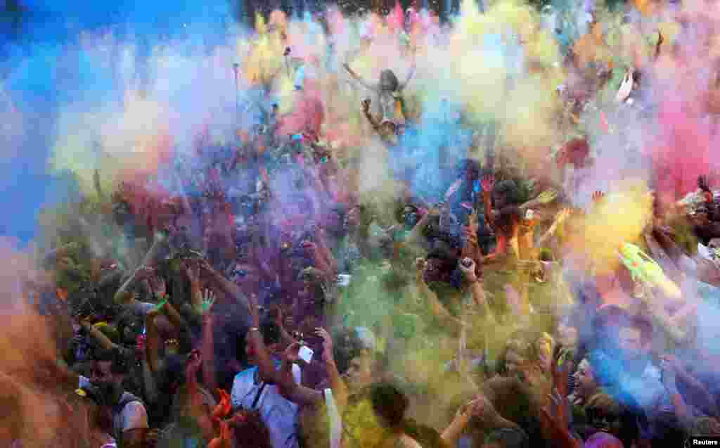 Revelers take part in the Monsoon Holi Madrid festival in Madrid, Spain, Aug. 13, 2016.