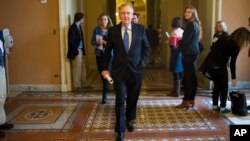 Senate Mitch McConnell of Ky. walks to the Senate Chamber on Capitol Hill, in Washington, Nov. 13, 2014.