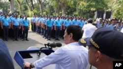In this photo provided by the Presidential Photographers Division, Malacanang Palace, Philippine President Rodrigo Duterte speaks to erring policemen during an audience at the Presidential Palace grounds in Manila, Philippines, Feb. 9, 2017.