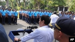 FILE - Philippine President Rodrigo Duterte speaks to erring policemen during an audience at the Presidential Palace grounds in Manila, Philippines, Feb. 9, 2017.