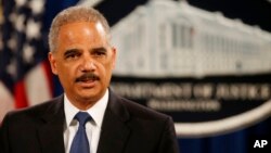 Attorney General Eric Holder speaks at a news conference at the Justice Department in Washington, May 19, 2014.