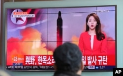 FILE- A man watches a TV news program reporting about North Korea's missile launch in Seoul, South Korea, Feb. 12, 2017.