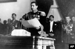 FILE - The Shah of Iran, Mohammad Reza Pahlavi, reads his inaugural speech at the initial session of his nation's first senate in Tehran, Iran, Feb. 16, 1950.