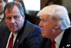 FILE - New Jersey Gov. Chris Christie listens to President Donald Trump, March 29, 2017, at the White House in Washington. Christie, Trump's fiercest critic among those seeking the 2024 Republican presidential nod, ended his campaign Jan. 10, 2024.