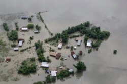 An aerial view of flooded Majuli, an island in River Brahmaputra, Assam, India, Tuesday, July 16, 2019.