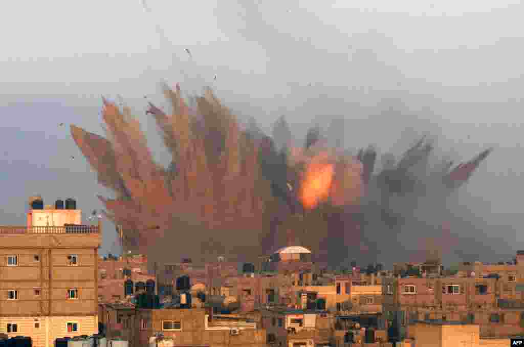 A ball of fire is seen following an Israeli air strike in Rafah, in the southern of Gaza Strip. Israeli warplanes kept up deadly raids on Gaza but failed to stop Palestinian militants firing rockets across the border, as the U.S. offered to help negotiate a truce.