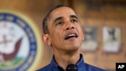 President Barack Obama speaks to members of the military and their families at a Marine Corps Base Hawaii, Dec. 25, (AP Photo/Carolyn Kaster)