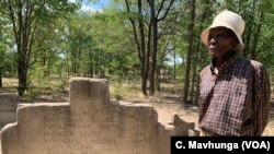 Melwa Ngwenya stands near a grave holding the remains of his son Sibangani, killed in February 1983 in Tsholotsho, Zimbabwe. Ngwenya seeks compensation for the state-sanctioned massacres known as Gukurahundi.