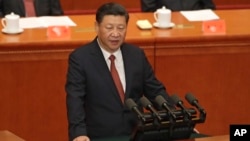 Chinese President Xi Jinping speaks during a ceremony to commemorate the 90th anniversary of the founding of the People's Liberation Army at the Great Hall of the People in Beijing, Aug. 1, 2017. 