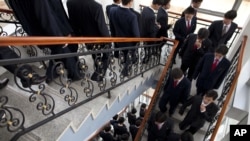 FILE - Students at the Pyongyang University of Science and Technology descend stairs after a seminar and lecture, Oct. 5, 2011.