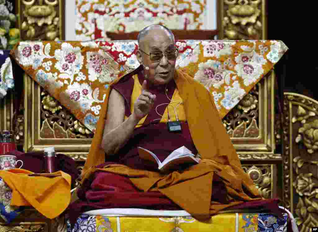 The Dalai Lama Tenzin Gyatso delivers his message as he attends a fair in Milan.