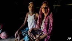 Rohingya Muslim man Sultan Mehmood, 62, and his wife, Haseena Begum, 45, sit for a photograph inside their shelter near Balukhali refugee camp, Bangladesh. The couple stayed in their hometown when violence broke out last month in Myanmar. That decision left the couple open to attack. “She was raped by three soldiers while I was mercilessly beaten up,” Mehmood said, sighing deeply.