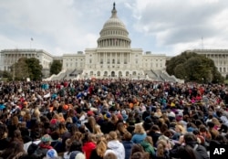 Students rally outside the Capitol Building in Washington, March 14, 2018.