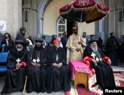 Priests attend the burial ceremony of the Ethiopian Airlines Flight ET 302 crash victims at the Holy Trinity Cathedral Orthodox church in Addis Ababa, March 17, 2019.