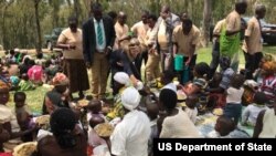 U.S. Ambassador to Rwanda Erica J. Barks-Ruggles and Rwandan citizens. 