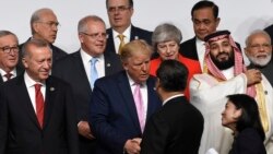 2019年6月28日，中国国家主席习近平与美国总统在日本大阪G20峰会上握手寒暄。（AP图片）