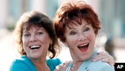 FILE - Actresses Erin Moran (left) and Marion Ross played daughter and mother on "Happy Days." They are pictured, June 18, 2009, in North Hollywood. Moran died Saturday at age 56.