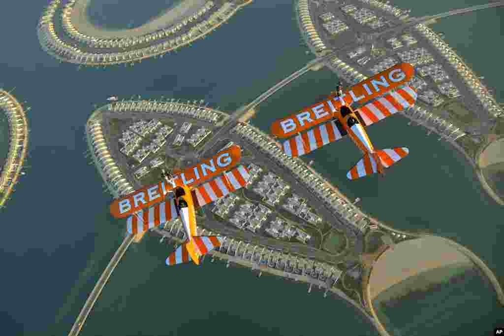 The Breitling Wingwalkers fly over Durrat Al Bahrain ahead of the Bahrain International Airshow 2014 which opens Jan. 16. Durrat Al Bahrain is a 21-km-square development created across a cluster of 15 islands.