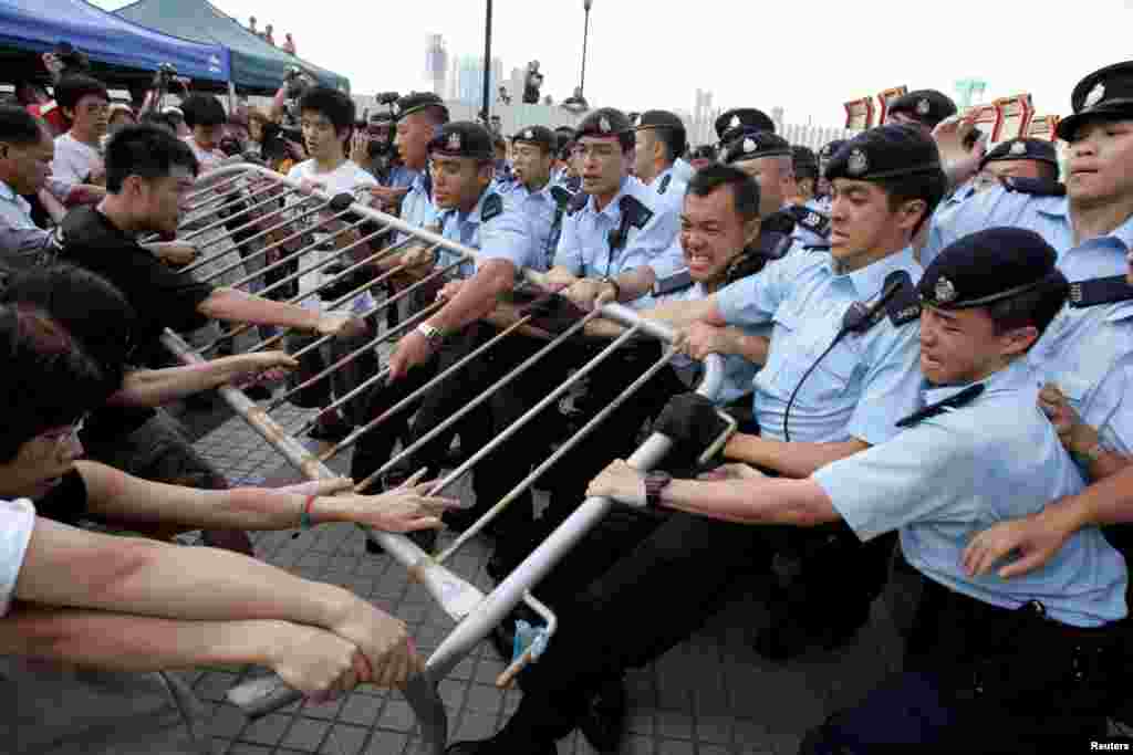Activists fight to save the Queen&#39;s Pier in Hong Kong&#39;s financial district, Aug. 1, 2007. The colonial-era pier became a civic battleground in 2007. The government wanted it removed for reclamation and roadworks, angering activists fighting to save a historic site.
