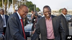 Before departing for AU summit in Addis Ababa, Kenyan President Kenyatta, left, with Deputy President Ruto, Nairobi, Kenya, Oct. 12, 2013.