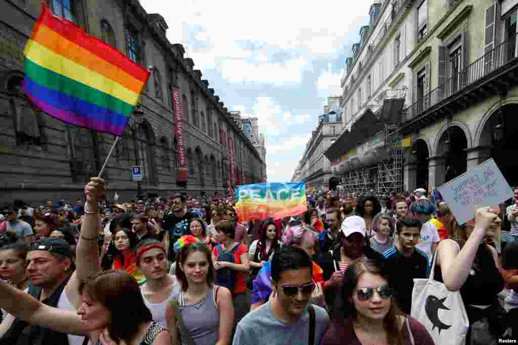 Participants take part in the annual Gay Pride parade in Paris, France June 24, 2017.