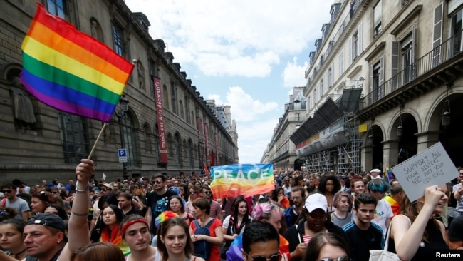 Participants take part in the annual Gay Pride parade in Paris, France June 24, 2017.