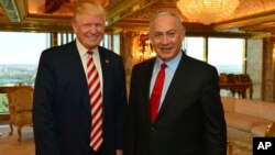 FILE - photo provided by Israeli Government Press Office - then-Republican Presidential candidate Donald Trump meets Israeli Prime Minister Benjamin Netanyahu in New York. 